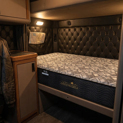 Custom semi truck mattress fitted to a sleeper cab bunk platform